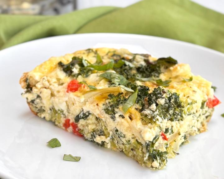 Hearty Breakfast Spinach frittata slice on a plate