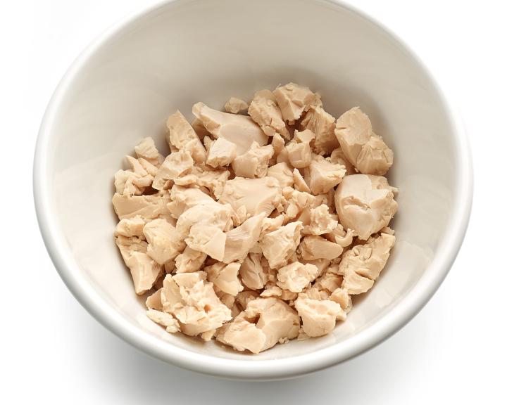 Bowl with cooked chicken breast