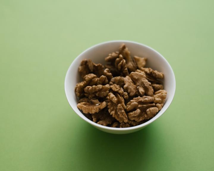 Small bowl with shelled walnuts