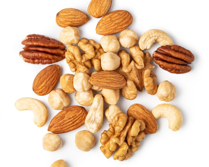 Group of mixed nuts including almonds, cashews, and walnuts