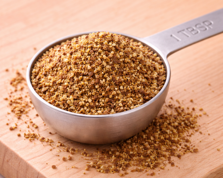 1 tablespoon of ground flaxseed in stainless steel measuring spoon