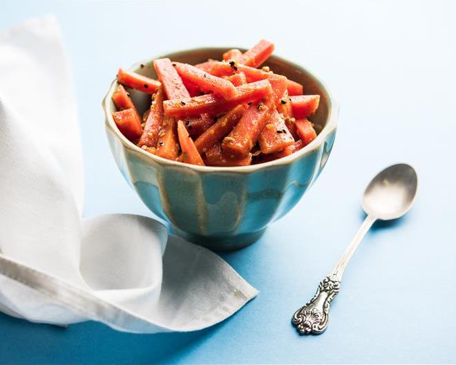 a bowl of roasted baby carrots
