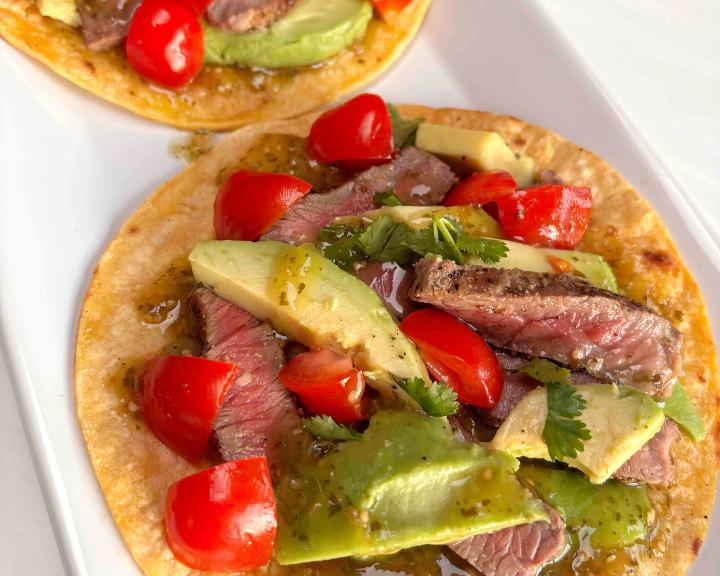 grilled steak tostada on a plate