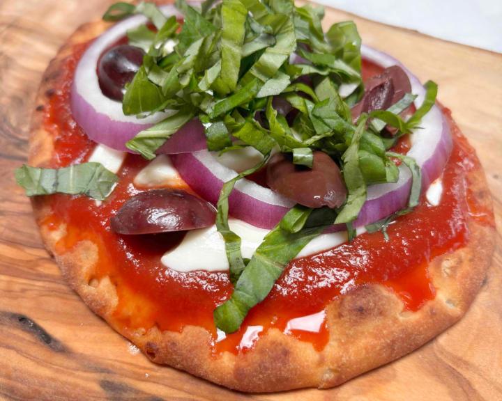 margherita pizza with vegetables on top