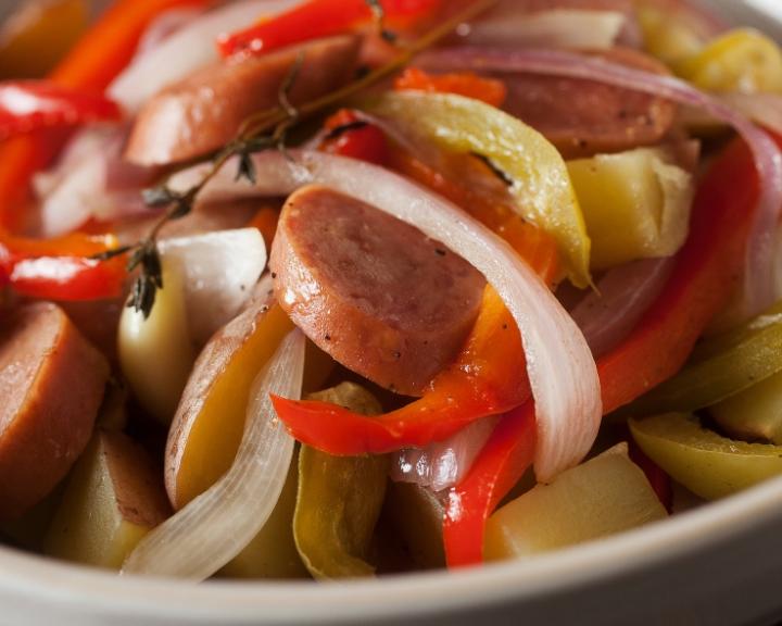 Sliced sausage, red &amp; white onions, bell peppers, potatoes, and thyme.