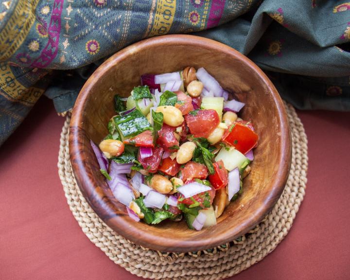 Peanut chaat in a wooden bowl.