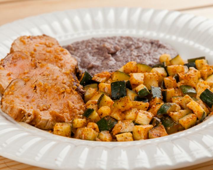 Mole Pork Tenderloin with Zucchini and Refried Black Beans