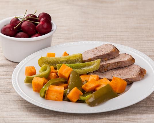 Spicy Apricot-Glazed Pork with Sweet Potatoes and Peppers